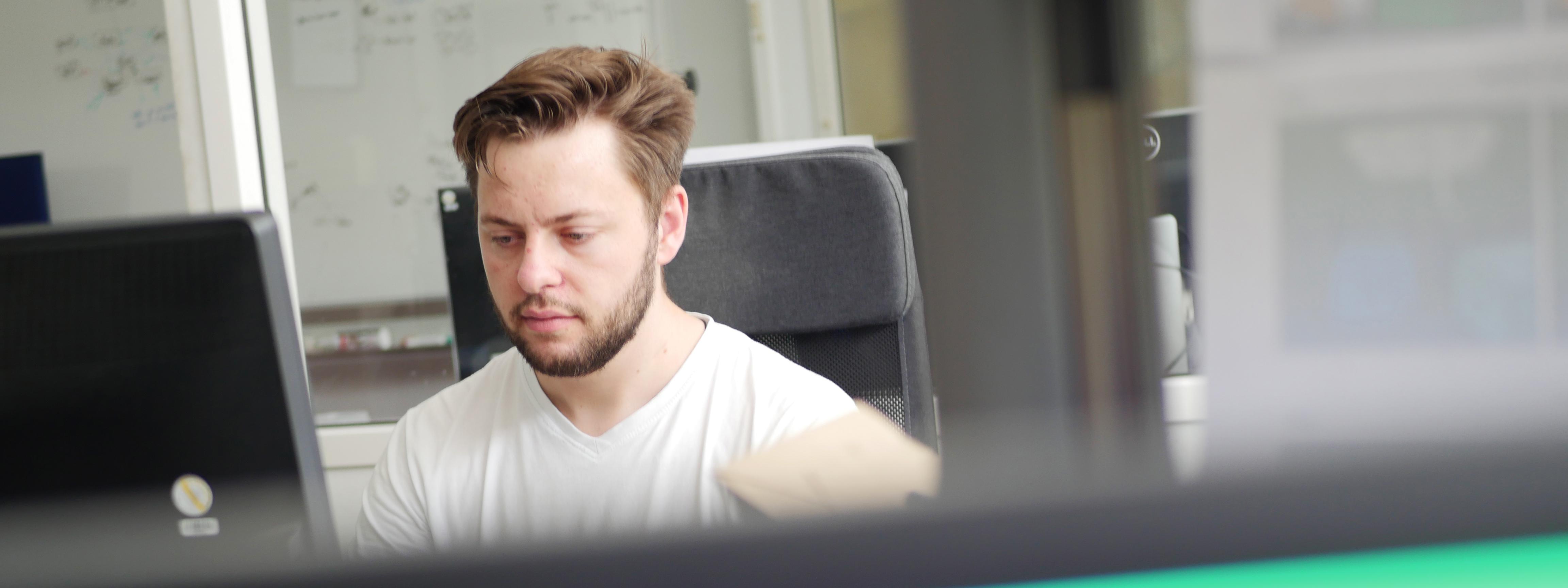 Mirko Mollik sitting at a desk