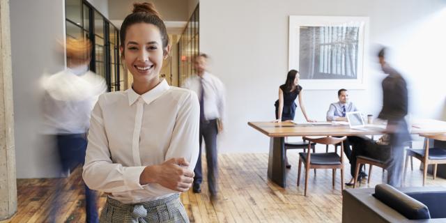 A woman standing in an office