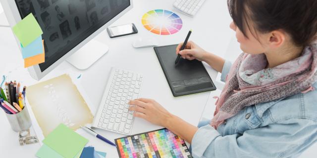 Woman sitting in front of a computer