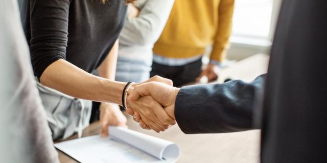 A handshake between a man and a woman