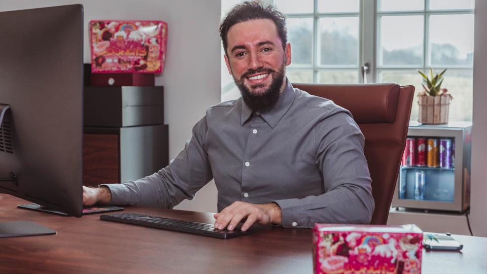 Enes Seker sitting at a desk