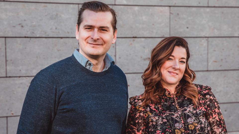 Sophie Frères and Philippe Frères in front of a wall