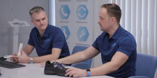 Dr. Jens Hollenbacher and Lars Hollenbacher sitting on a table together