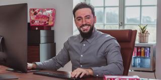 Enes Seker sitting at a desk