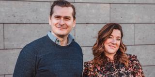 Sophie Frères and Philippe Frères in front of a wall