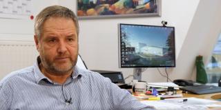 Ulrich Rotte in front of his desk