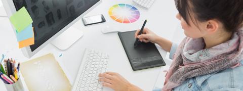 Woman sitting in front of a computer