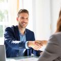 A man shaking hands with a woman