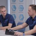 Dr. Jens Hollenbacher and Lars Hollenbacher sitting on a table together