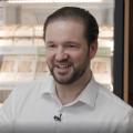 Alexander Eissing in front of refrigerator with food inside