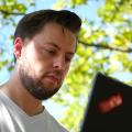 Mirko Mollik sitting in front of a laptop